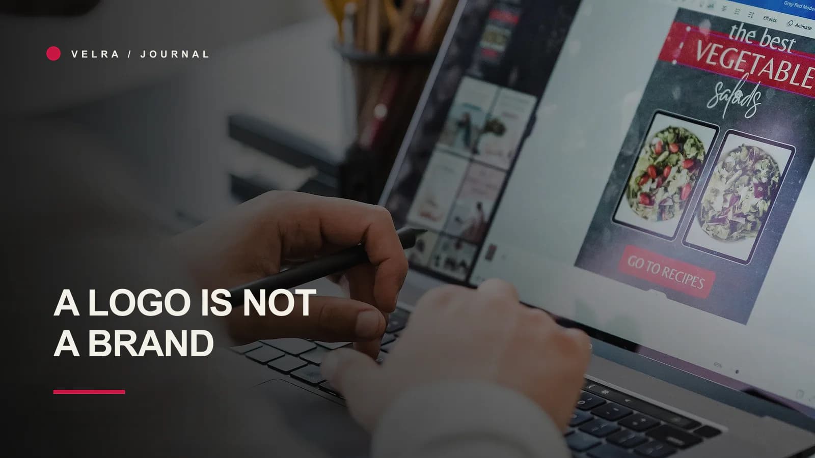 Graphic designer developing visual ideas at a laptop