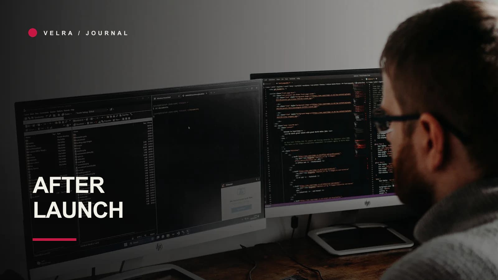 Developer maintaining software across two computer screens