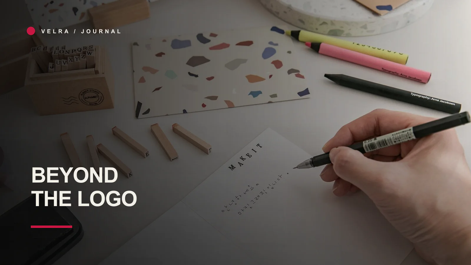 Creative identity workspace with stamps, paper and stationery
